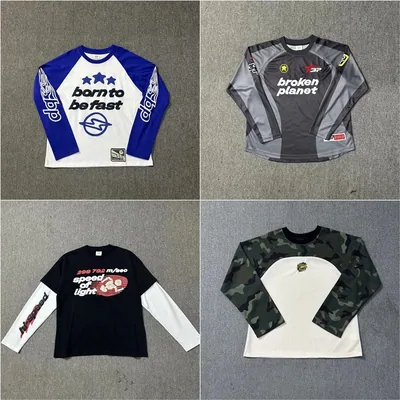 Four motocross-style jerseys and layered long-sleeve tops