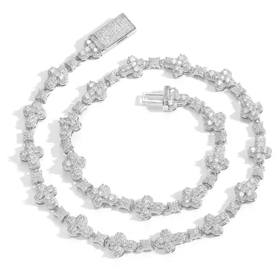 A silver chain necklace with clustered stone links on a white background
