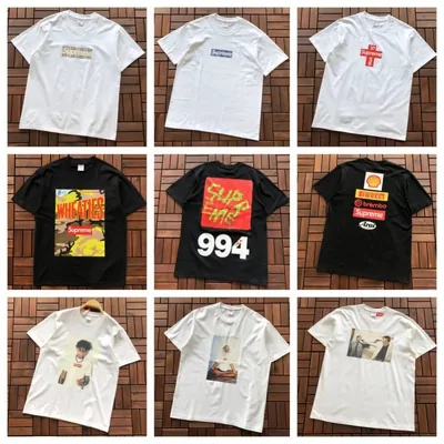 Nine printed T-shirts laid out in a grid, white and black
